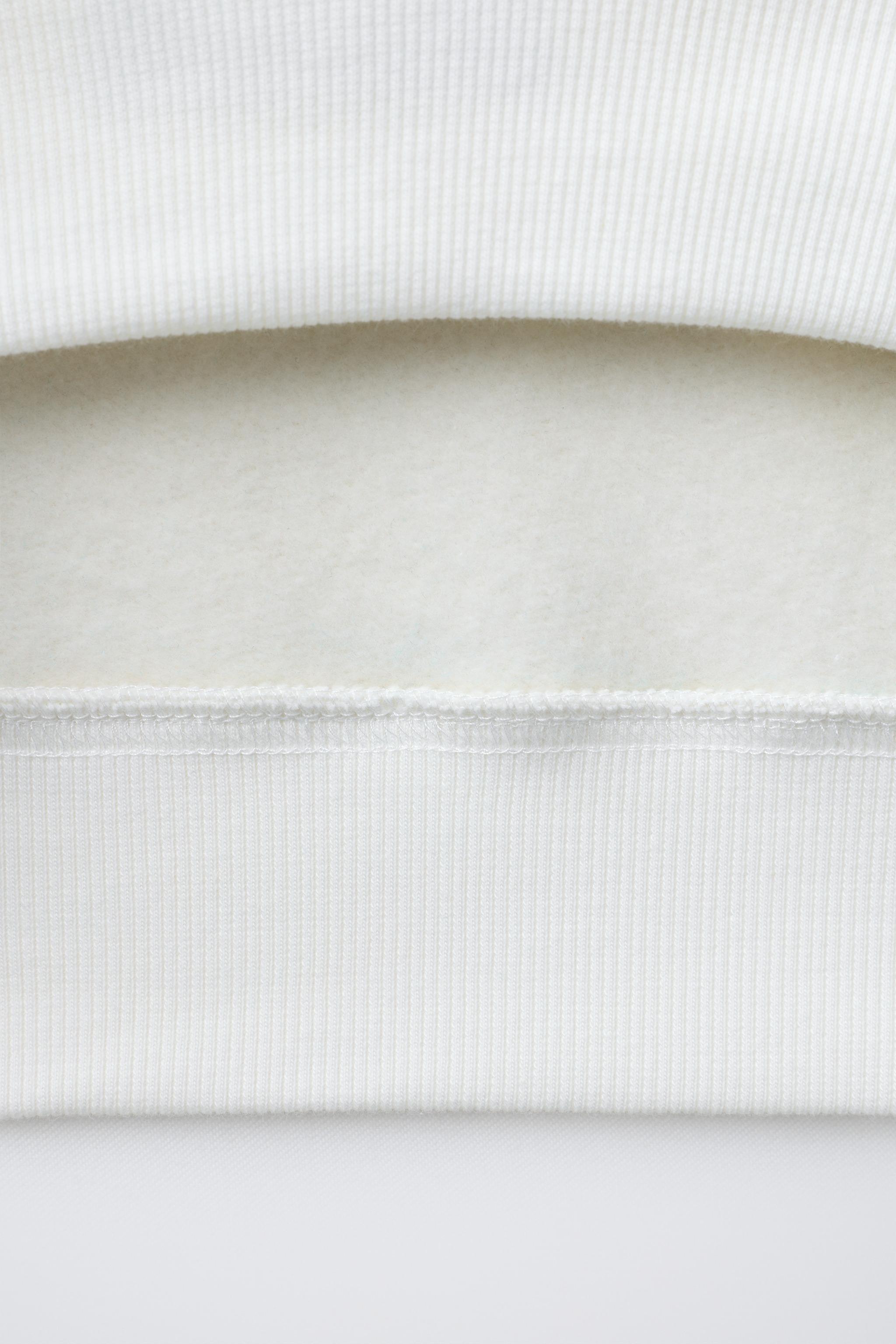 FLOCKED TEXT SWEATSHIRT